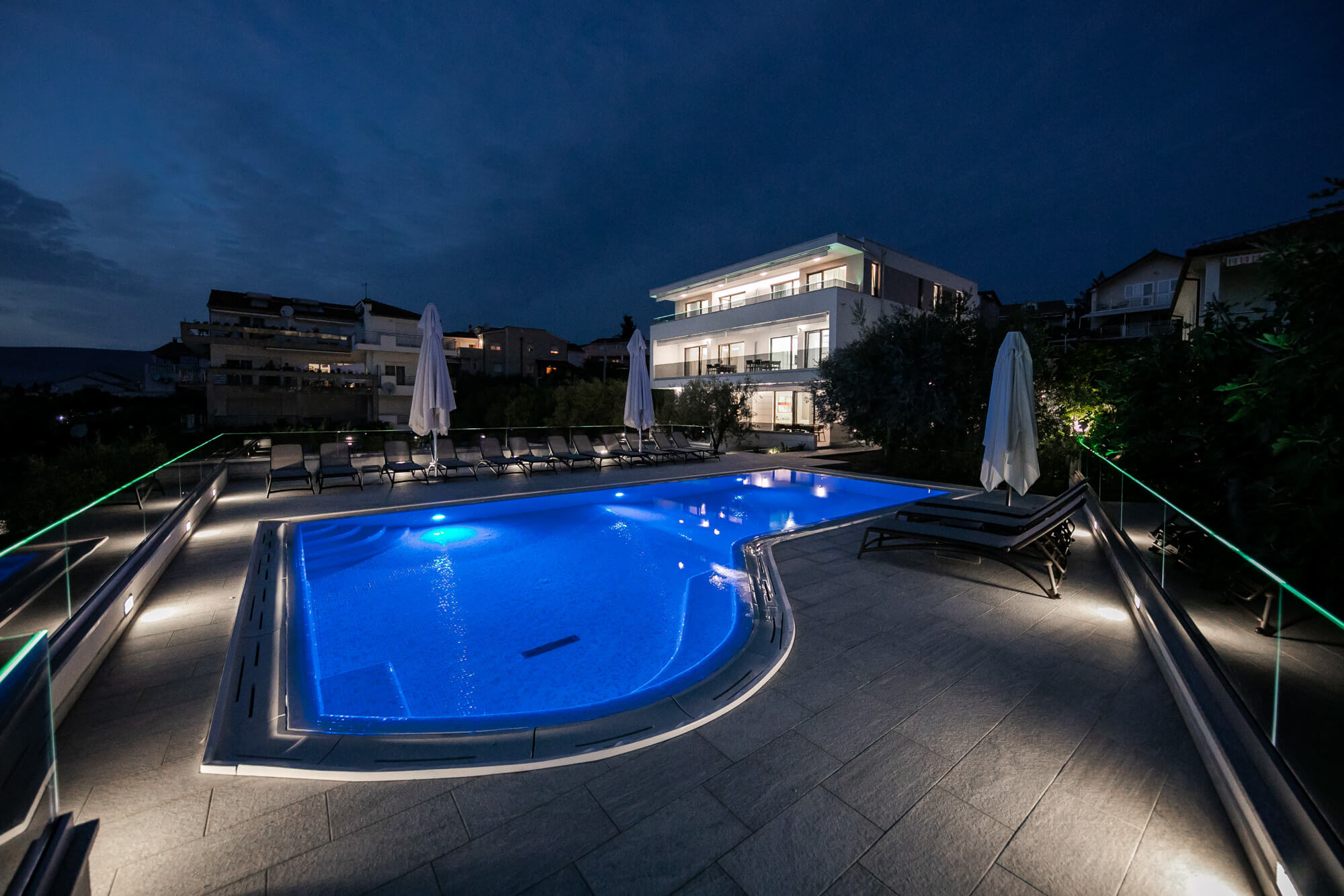 villa dora house and pool deck nighttime