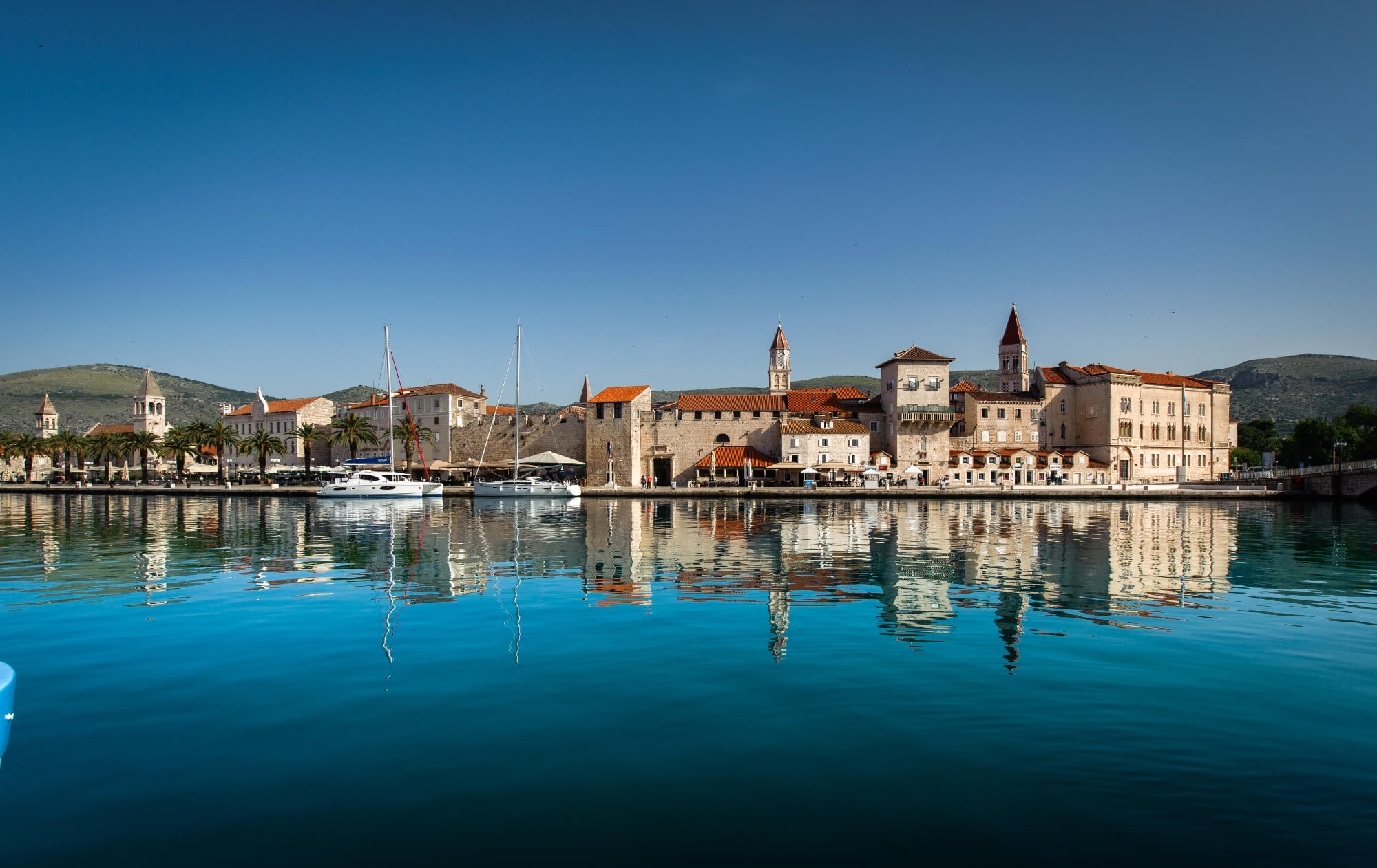 the coast of the city of Trogir with reflection